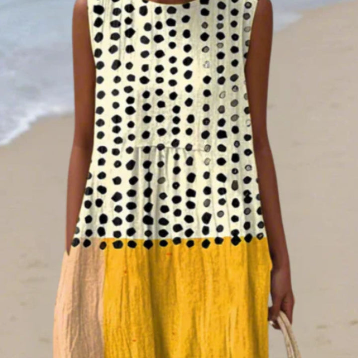 Vestito estivo lungo donna a pois, vestibilità comoda. Ideale per look casual, viaggi o eleganza quotidiana.
