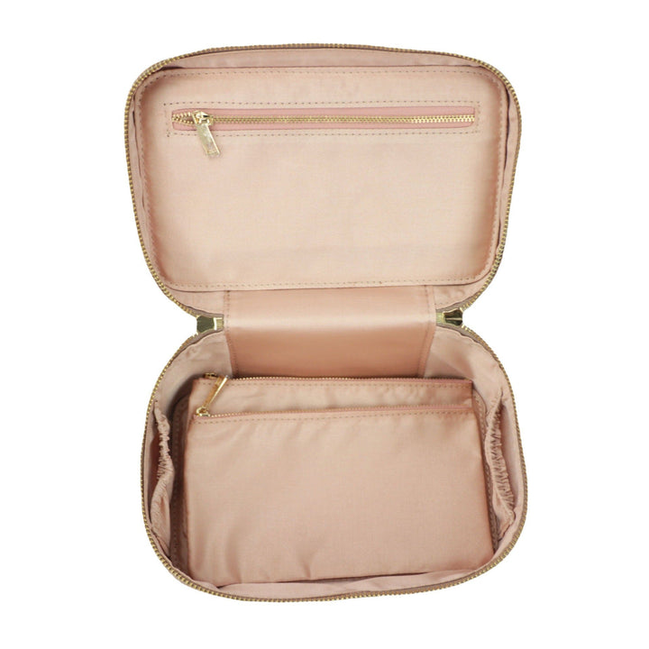 Beauty case da viaggio di lusso in vera pelle per donna, elegante custodia per trucco e accessori.