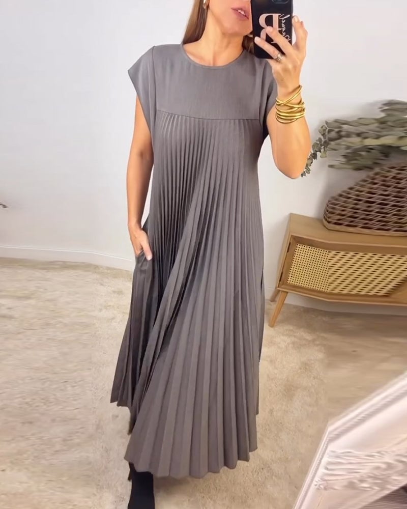 Abito donna elegante plissettato, maxi e fluido, vestito perfetto per cerimonia estiva.