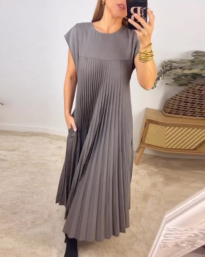 Abito donna elegante plissettato, maxi e fluido, vestito perfetto per cerimonia estiva.