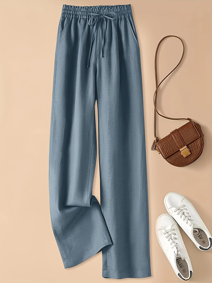 Pantaloni donna a vita alta con coulisse e tasche laterali, ideali per un comfort elevato e stile.
