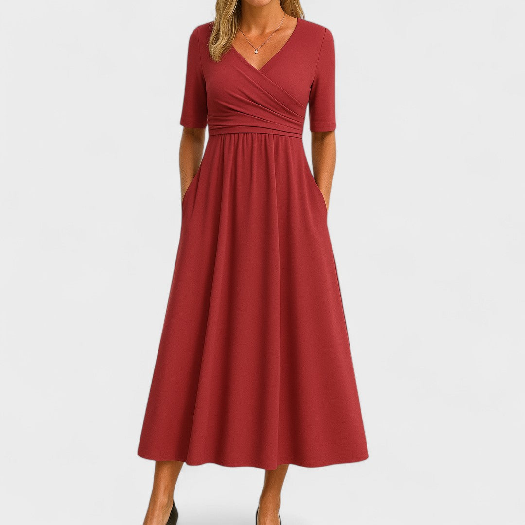 Abito midi donna con tasche e scollo incrociato, silhouette a-line e gonna svasata. Versatile primavera/estate.