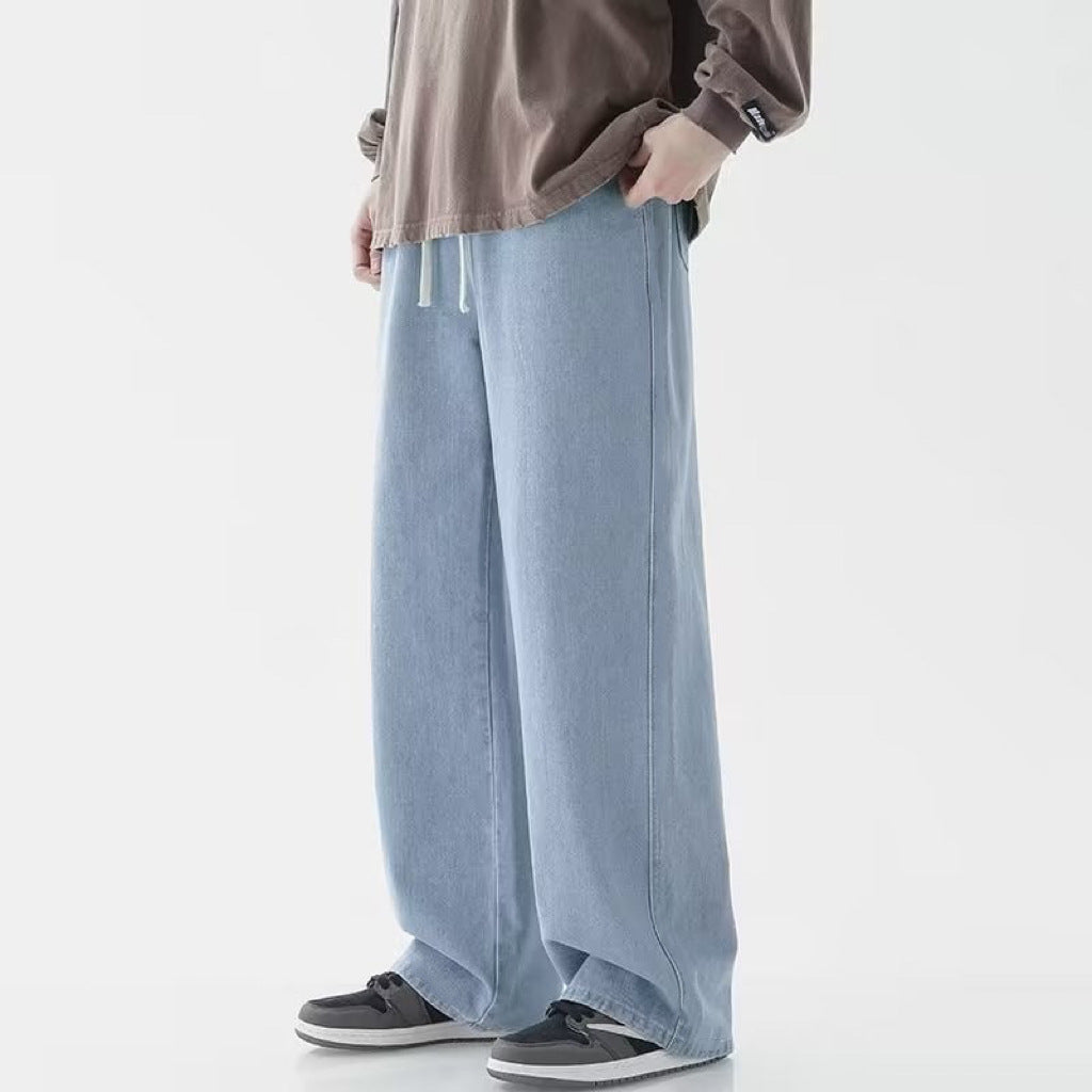 Moda maschile: pantaloni blu a gamba larga, vita media. Ideali per outfit casual e comodi di tendenza.