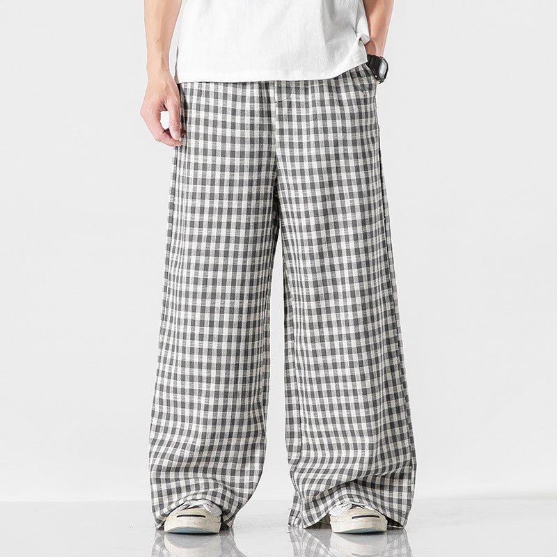 Pantaloni estivi uomo a quadri beige e blu con coulisse, vestibilità ampia per comfort e stile casual.