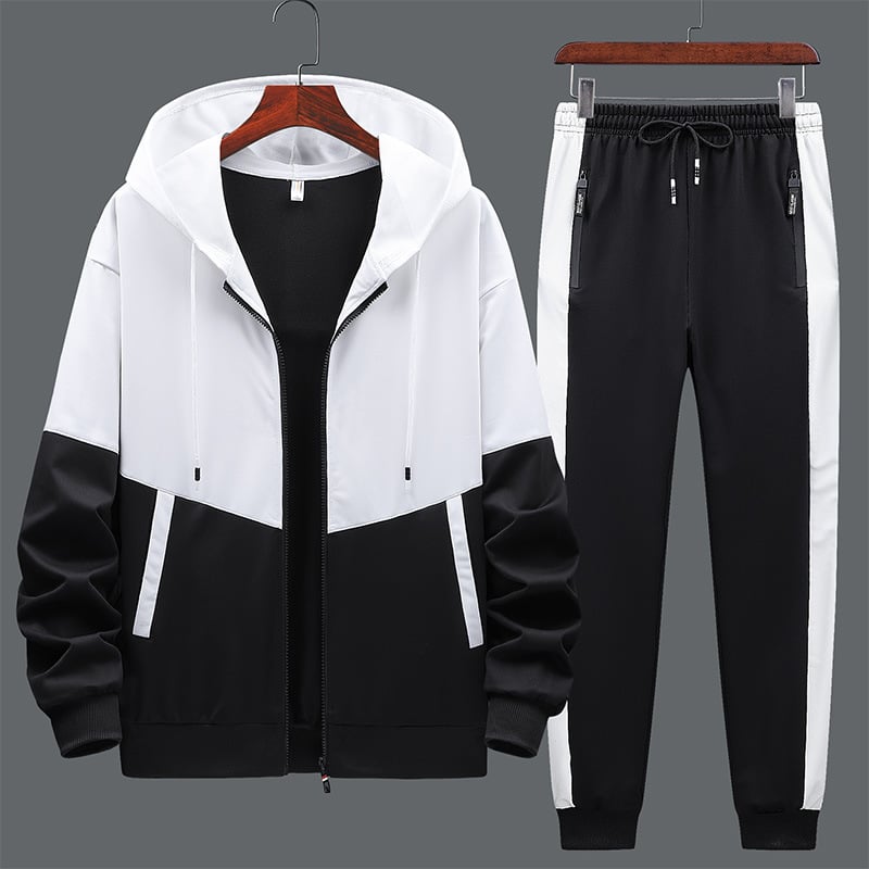 Set tuta sportiva uomo con felpa con cappuccio e pantaloni coordinati, per un look moderno e versatile.