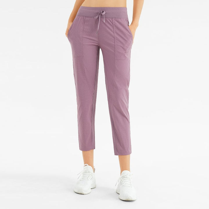 Pantaloni donna comodi a vita media, a nove decimi, con tasche, perfetti per yoga e relax.