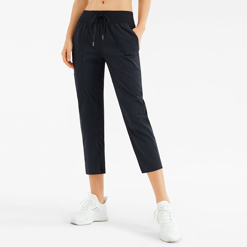 Pantaloni yoga donna comodi a nove decimi con tasche, ideali per fitness e relax.
