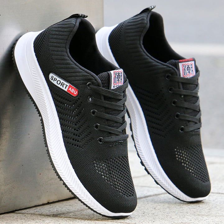 Calzature da running uomo grigie e nere con lacci, design moderno per comfort e prestazioni.