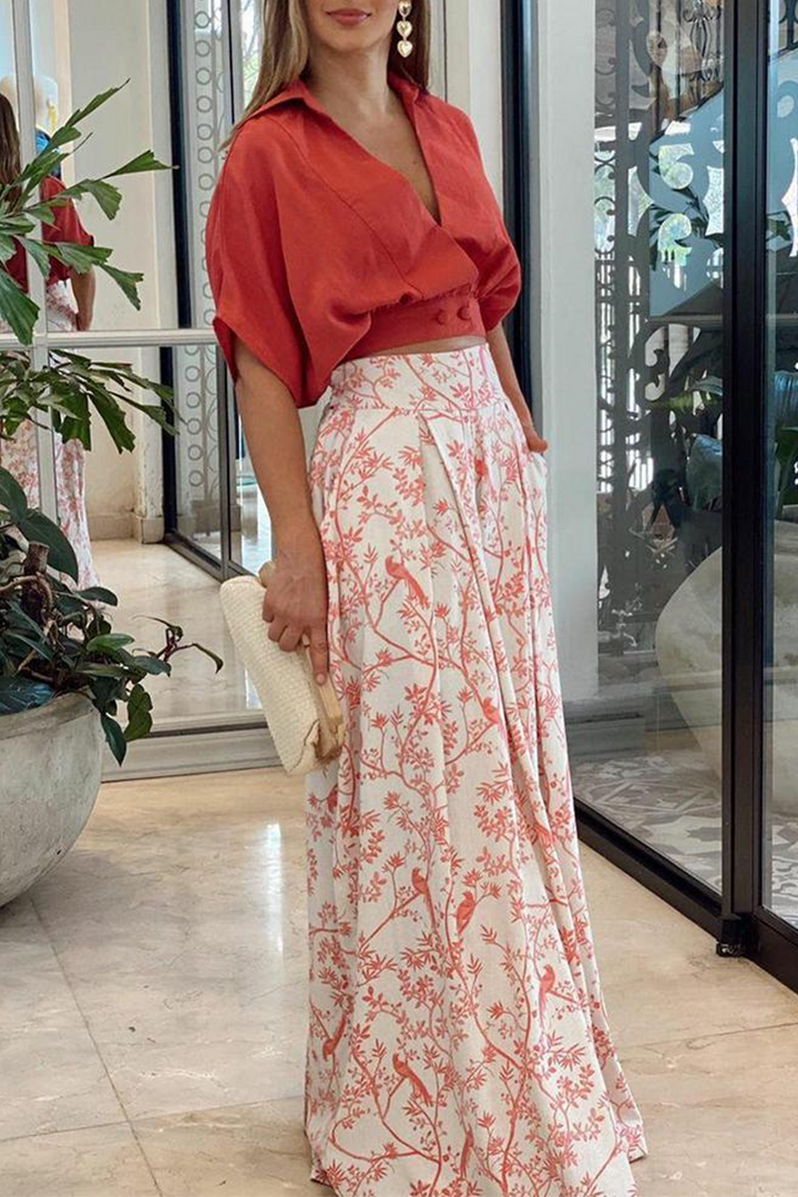 Completo donna elegante due pezzi con pantaloni palazzo fluidi e top chic, perfetto per serate o eventi.