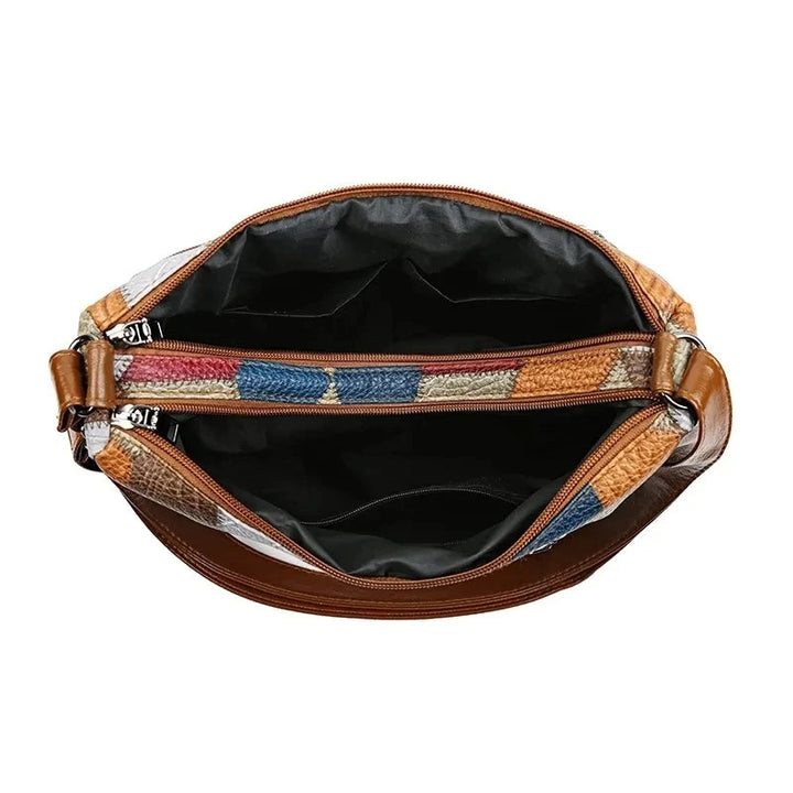Borsa a mano donna, classica ed elegante, in effetto pelle, ideale per lo stile quotidiano.