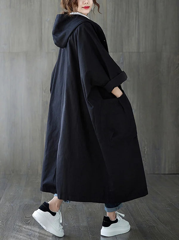 Giacca lunga impermeabile donna con cappuccio, protezione da pioggia e vento, perfetta per l'autunno.