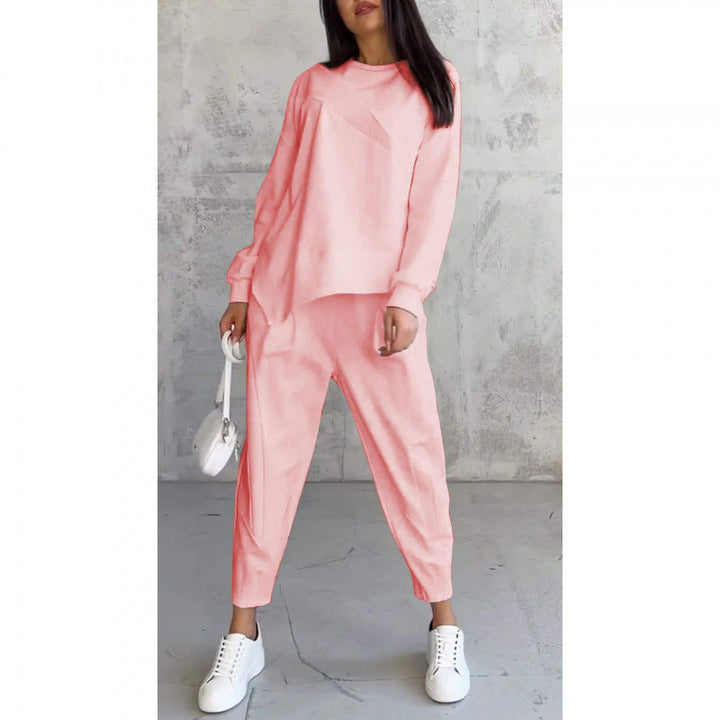 Completo sportivo donna moderno: felpa asimmetrica e pantaloni versatili. Perfetto per un look casual e dinamico.