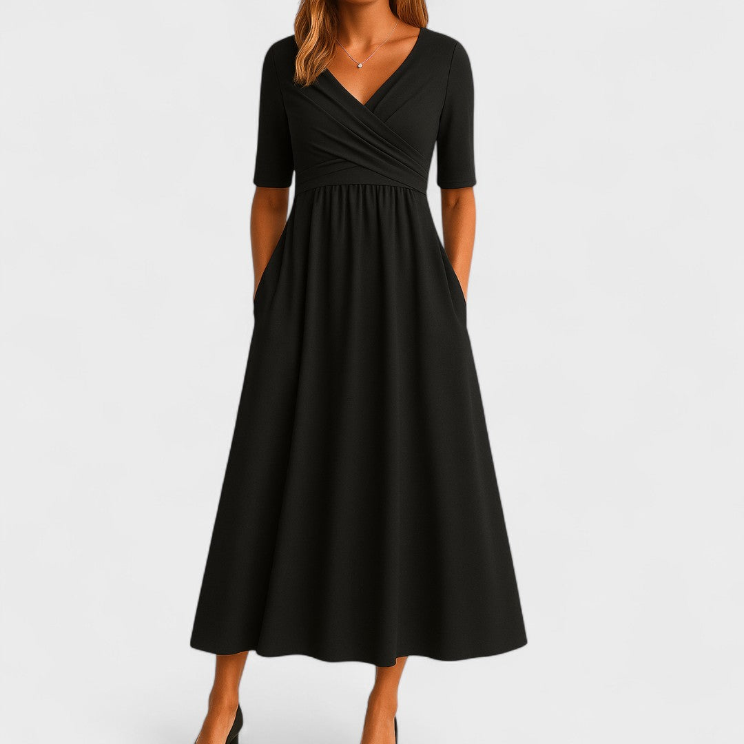 Abito midi donna elegante con scollo incrociato, tasche e gonna svasata. Ideale per look primaverili.