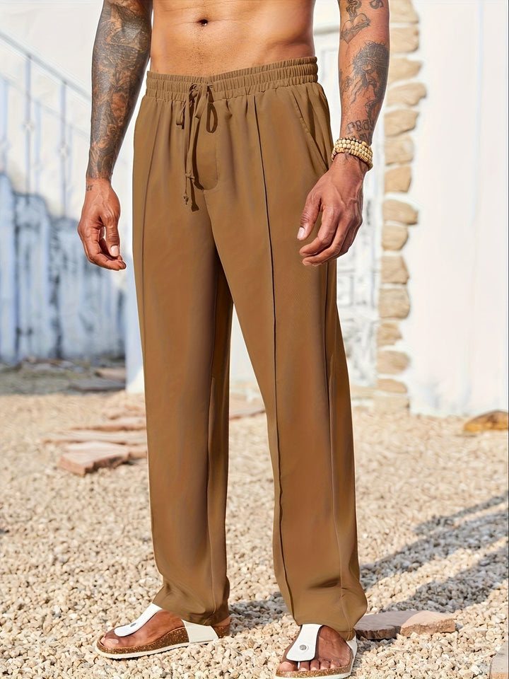 Pantaloni straight fit uomo grigi, tessuto antipiega, perfetti per look streetwear o eleganti e comodi.