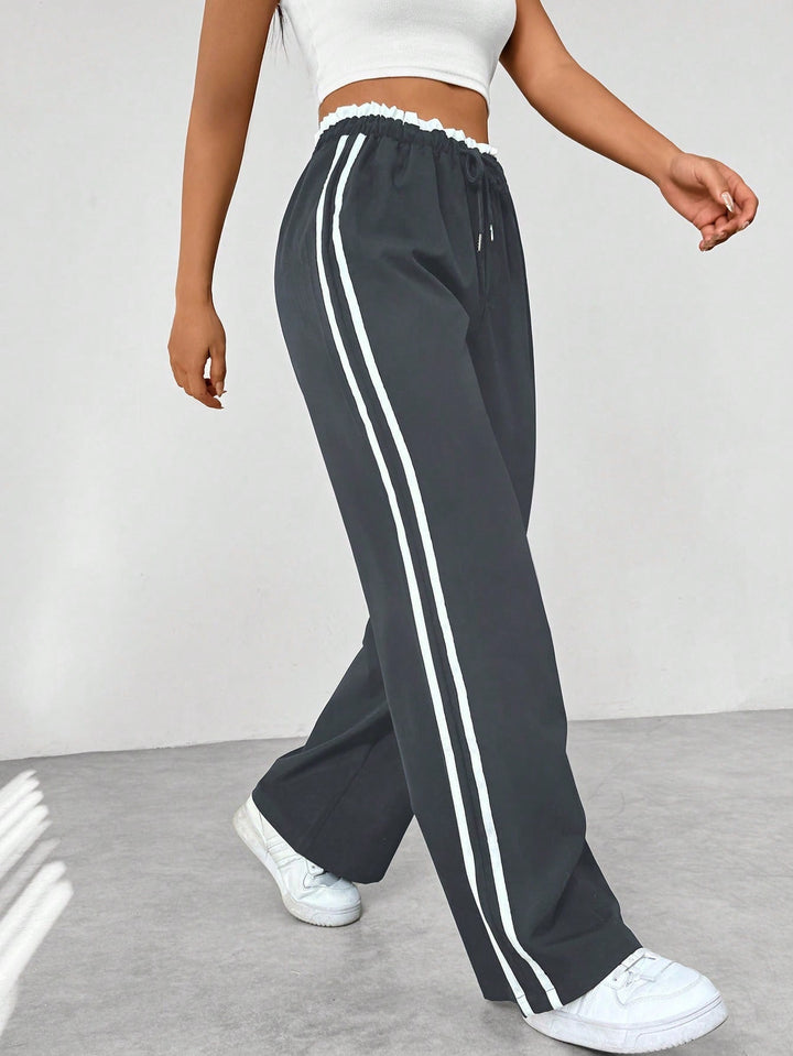 Pantaloni donna casual a gamba larga, versatili per sport o tempo libero, confortevoli ogni giorno.