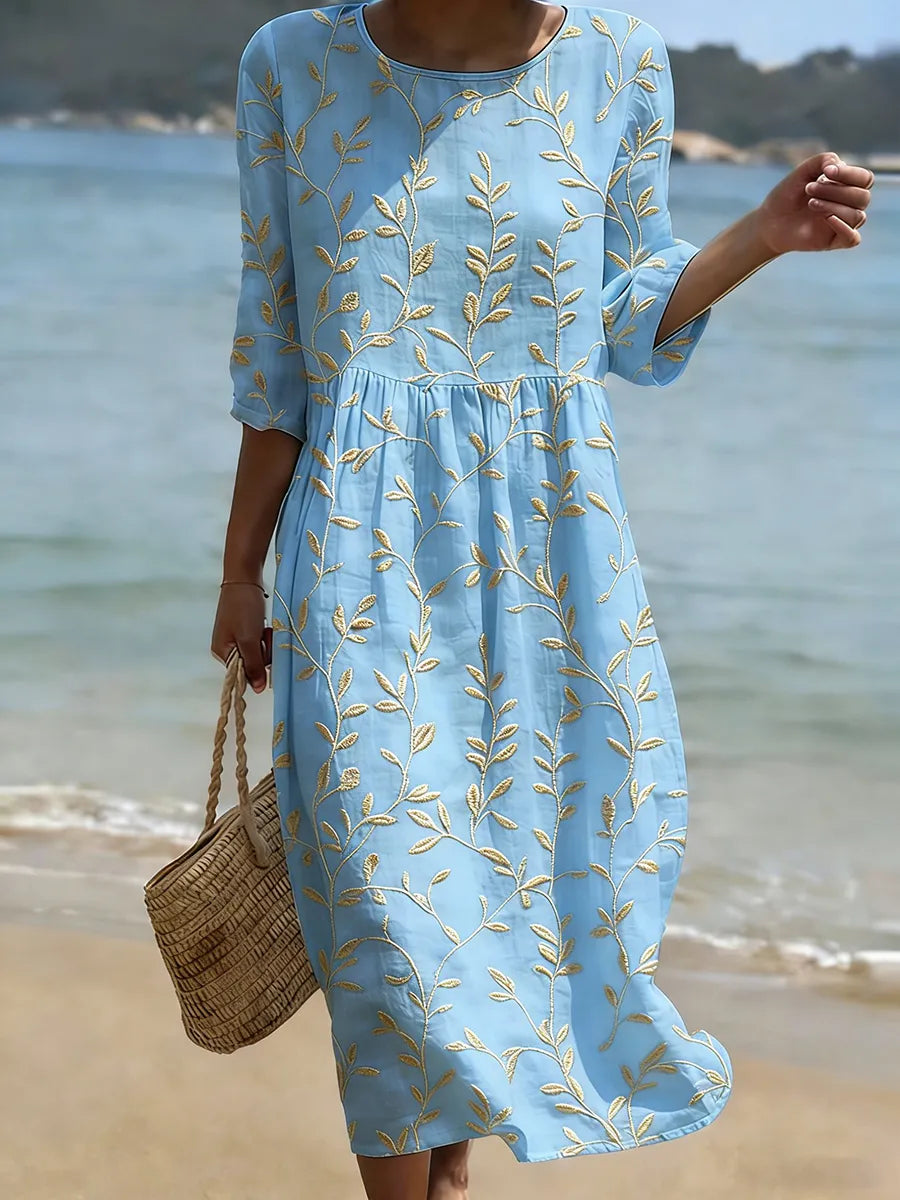 Abito midi donna floreale con stampa vivace, vestibilità comoda, ideale per un look casual chic primaverile estivo.