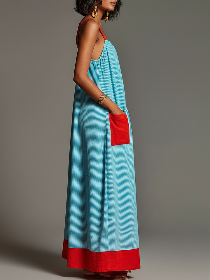 Maxi abito donna a spalline sottili, design a righe, vestibilità fluida con tasche. Ideale per comfort estivo.