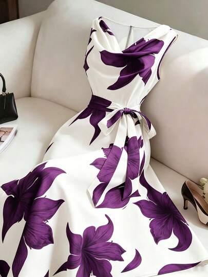 Elegante vestito floreale midi senza maniche con nodo in vita, ideale per occasioni speciali o casual.