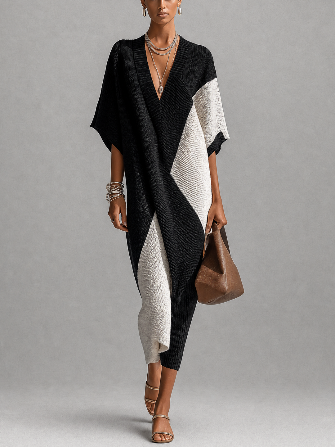 Abito midi donna bicolore nero/avorio con scollo a V, perfetto per look eleganti e versatili primavera/estate.