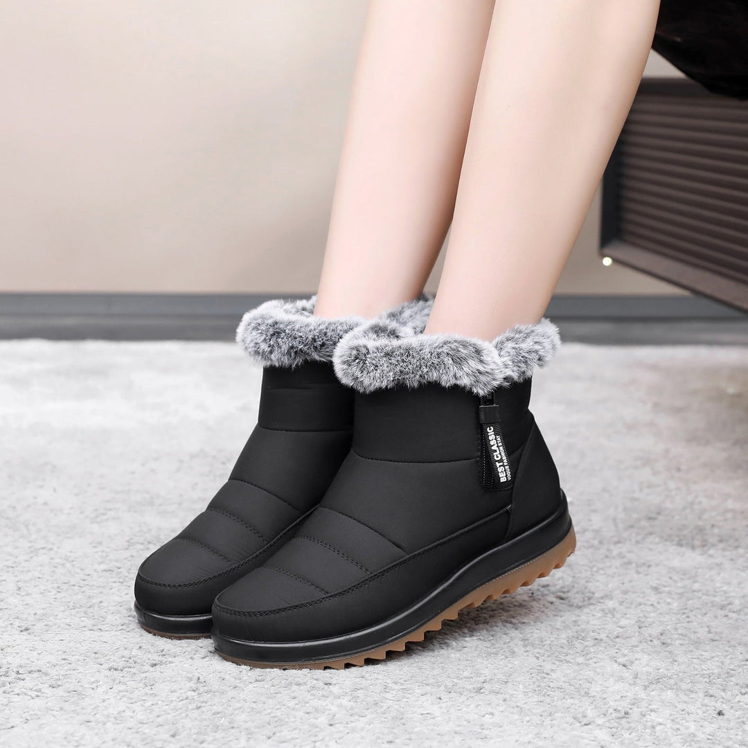 Stivaletti invernali donna neri con zip. Caldi, protettivi per neve e freddo. Comfort e moda invernale garantiti.
