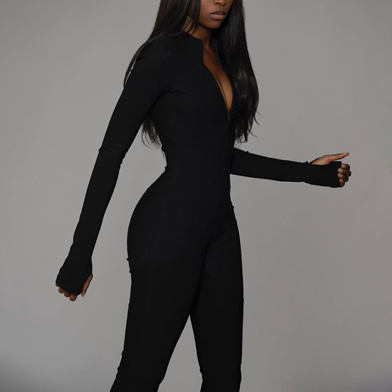 Tuta sportiva da donna moderna con zip frontale e vita alta, in tessuto traspirante per comfort tutto il giorno.
