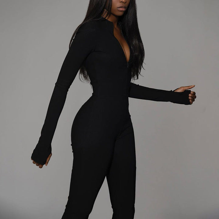 Tuta sportiva da donna moderna con zip frontale e vita alta, in tessuto traspirante per comfort tutto il giorno.