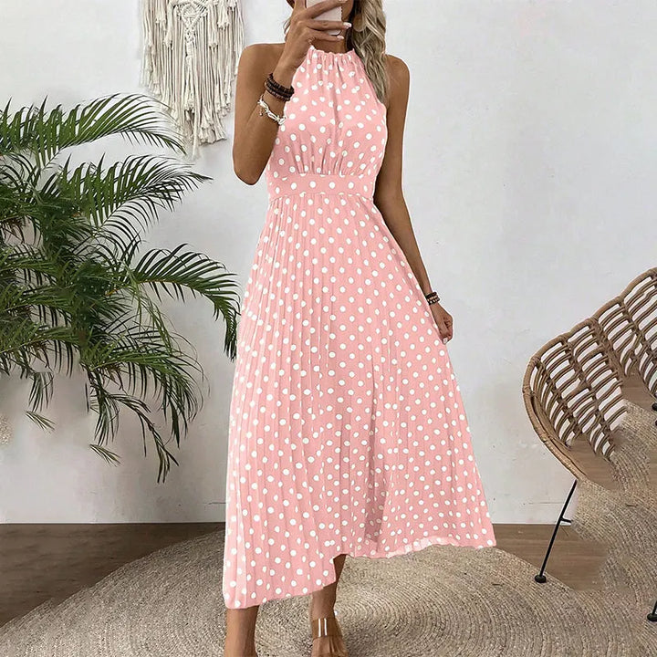 Vestito lungo donna a pois, collo halter, ideale per eventi estivi o look giornalieri eleganti.