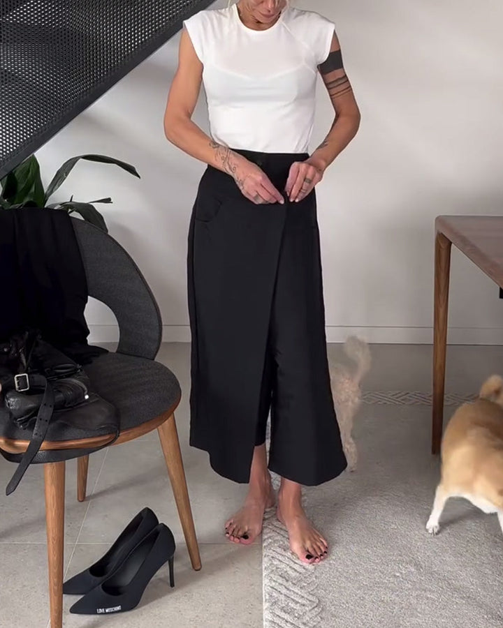 Pantaloni larghi donna asimmetrici neri a vita media, perfetti per look eleganti e confortevoli.