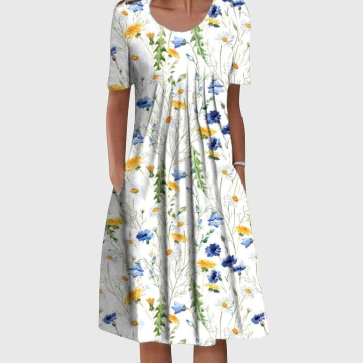 Vestito midi donna floreale con stampa vivace, gonna svasata. Ideale per la moda primavera estate.