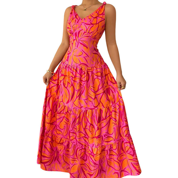 Abito estivo senza maniche e fluido, con accattivante stampa tropicale. Maxi abito ideale per comfort e stile d'estate.
