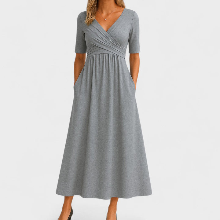 Abito midi donna incrociato, elegante e casual, con tasche e gonna svasata. Ideale per primavera ed estate.