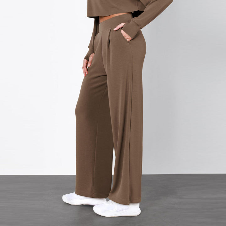 Pantaloni donna a vita alta, gamba dritta con morbido drappeggio. Look raffinato per moda e ufficio.