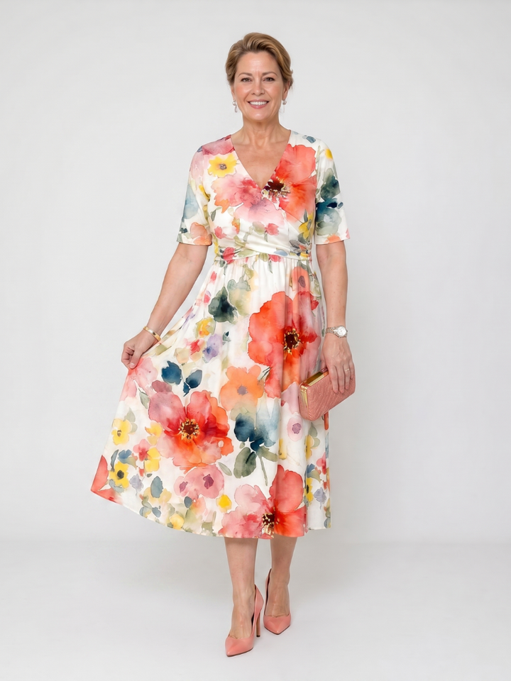 Abito midi floreale da donna con scollo a V e maniche corte. Vestito estivo leggero, perfetto per il giorno.