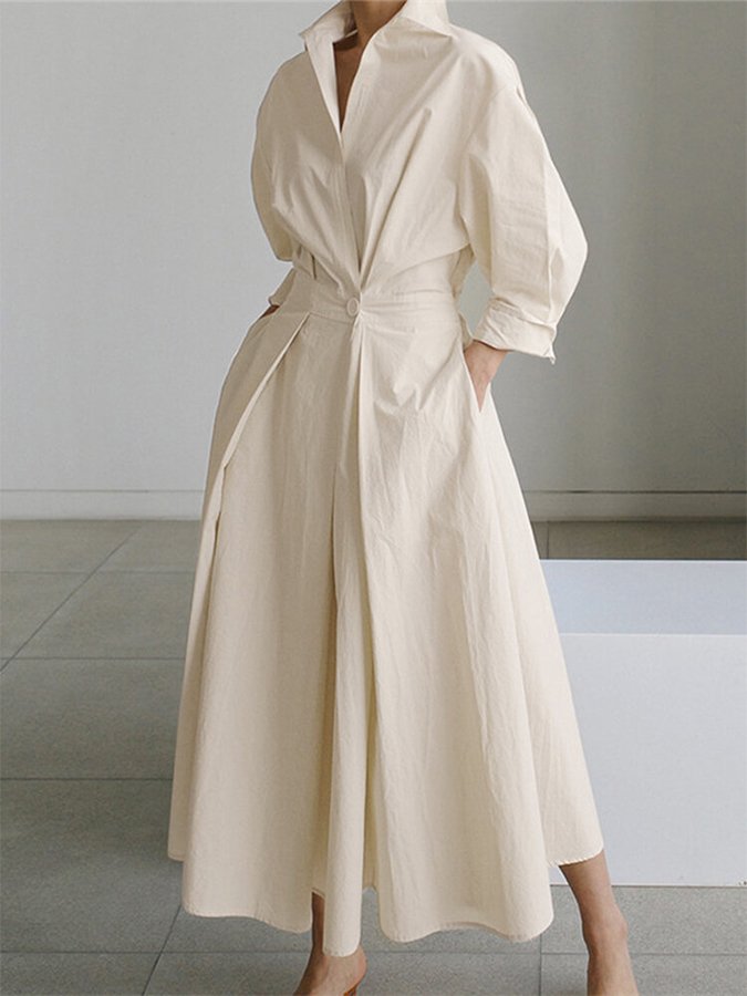 Maxi vestito chemisier da donna, design fluido con colletto button-down e cintura in vita per una silhouette sofisticata.
