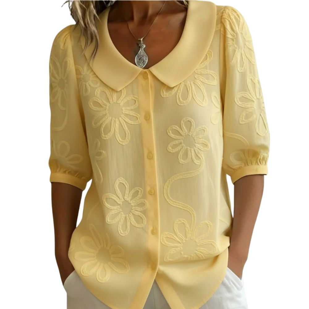 Camicetta donna elegante floreale con colletto arrotondato. Blusa leggera per un look raffinato e femminile.