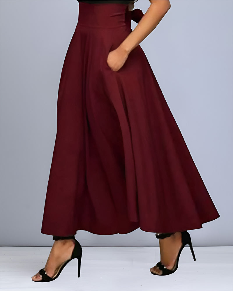 Gonna lunga elegante donna in tessuto fluido, perfetta per l'autunno. Ideale per look versatili.