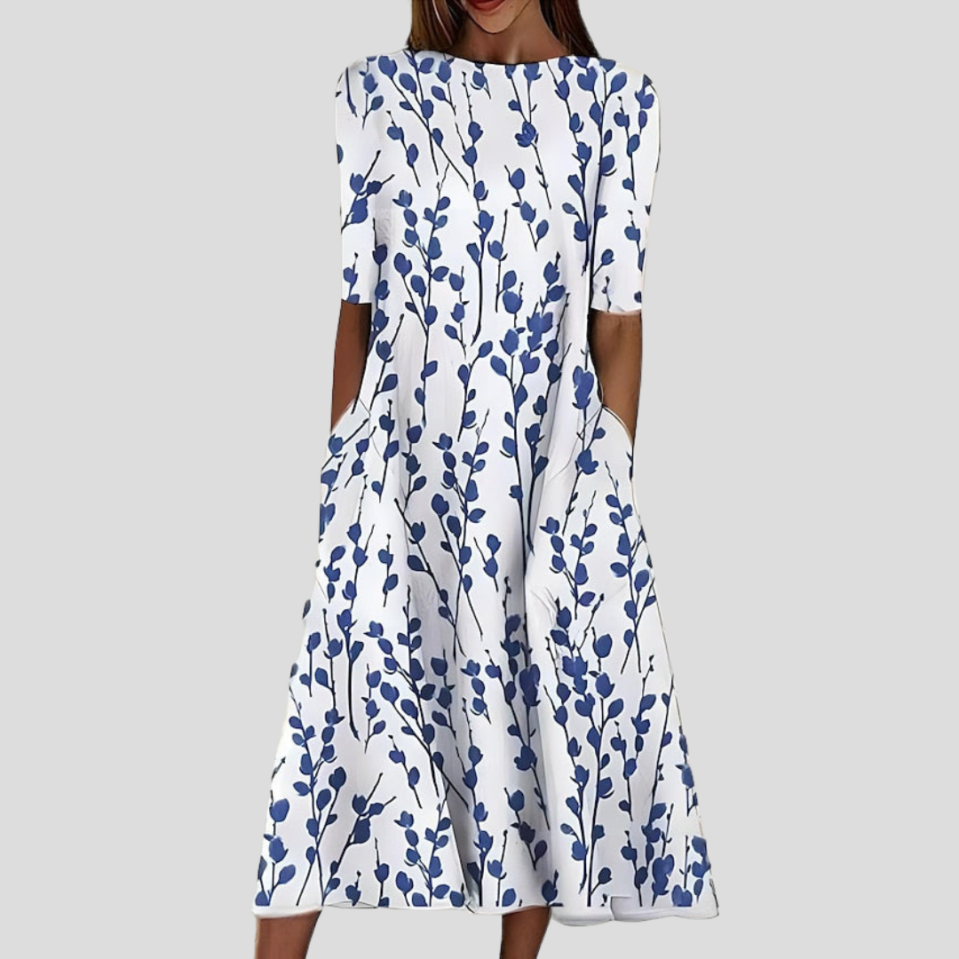 Abito estivo midi da donna con stampa floreale costiera, ideale per un look casual e confortevole.