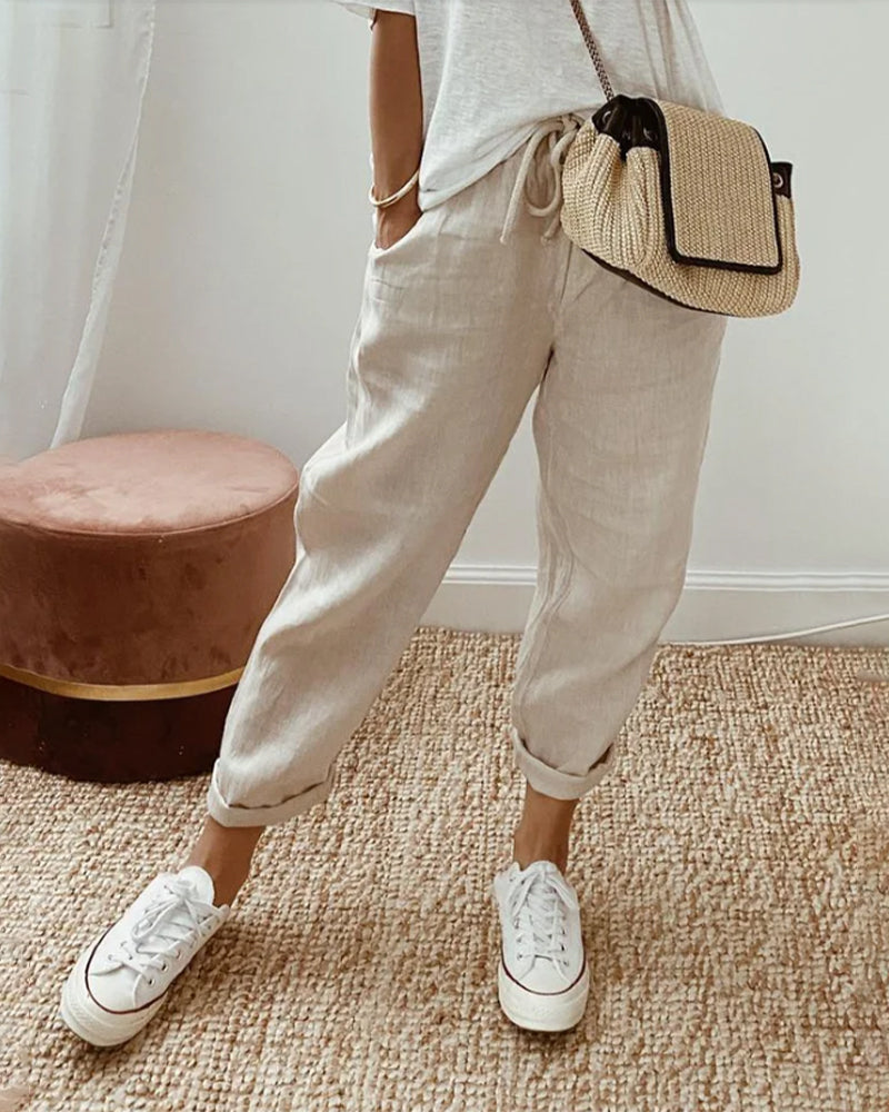 Pantaloni joggers donna casual a vita media, ideali per primavera ed estate. Comfort e stile per tempo libero.
