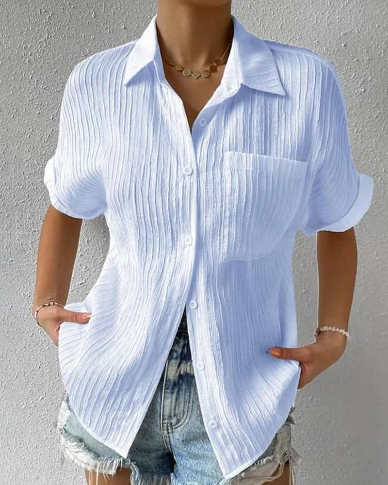 Blusa donna chic a manica corta, ideale per outfit elegante o casual in primavera ed estate.