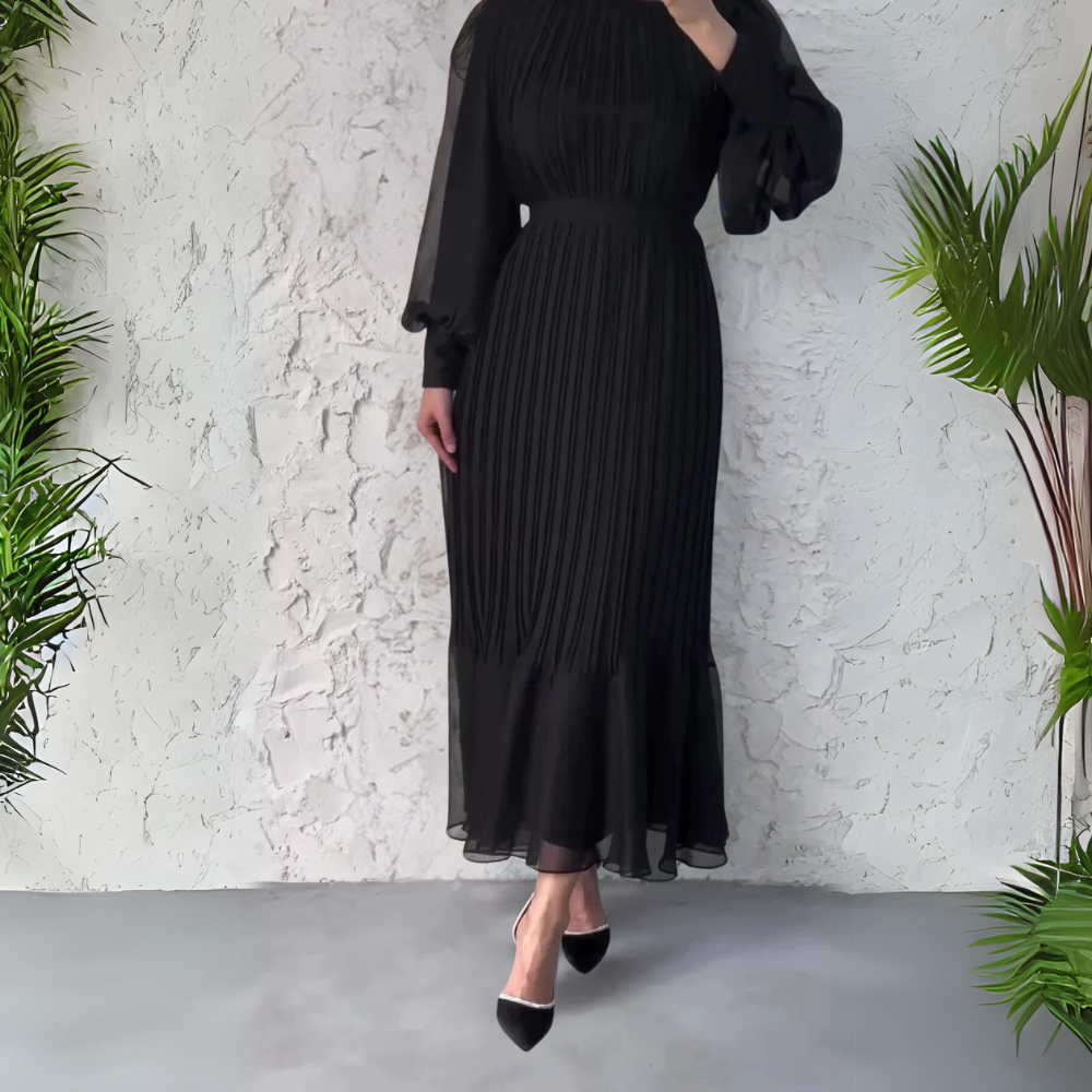 Abito da sera plissettato donna per occasioni speciali, modello elegante con dettagli raffinati a pieghe.