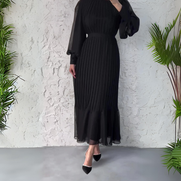 Abito da sera plissettato donna per occasioni speciali, modello elegante con dettagli raffinati a pieghe.