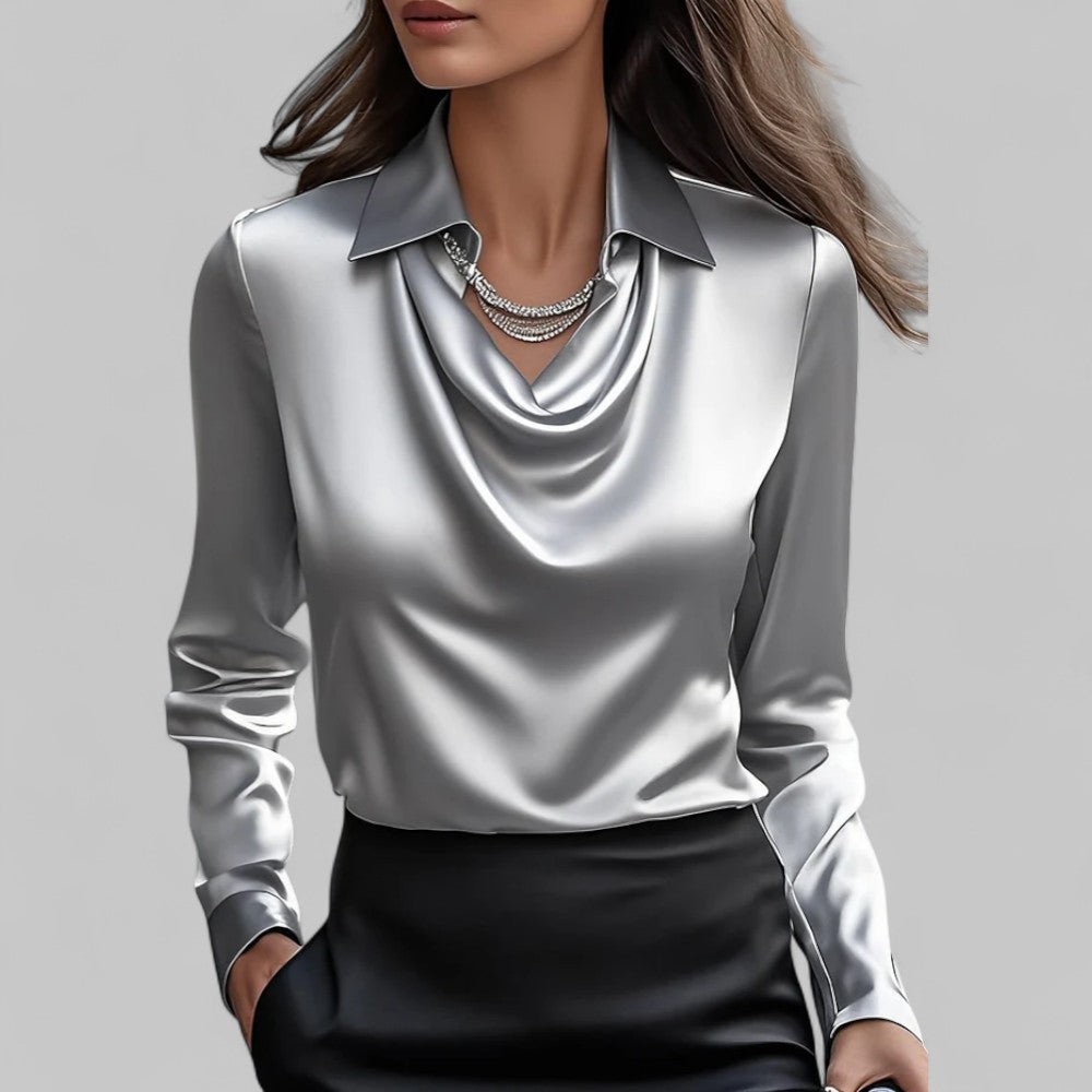 Elegante blusa da donna in satin, con raffinato collo drappeggiato e maniche lunghe. Stile classico.