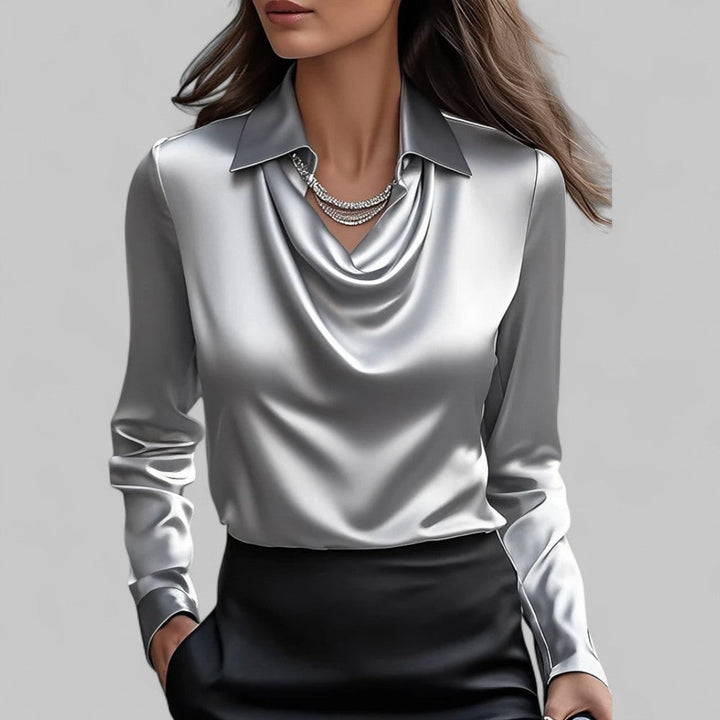 Elegante blusa da donna in satin, con raffinato collo drappeggiato e maniche lunghe. Stile classico.