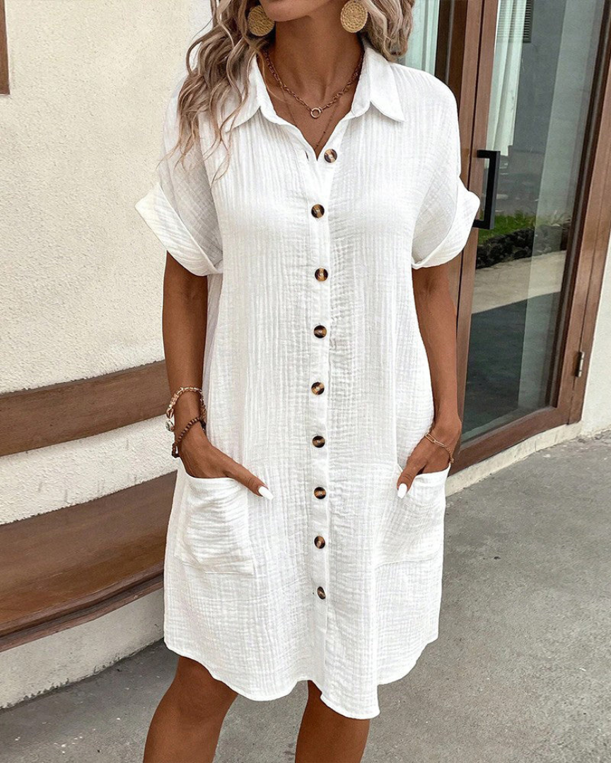Abito donna camicia lunga, maniche lunghe e bottoni, perfetto per un look versatile in primavera e autunno.