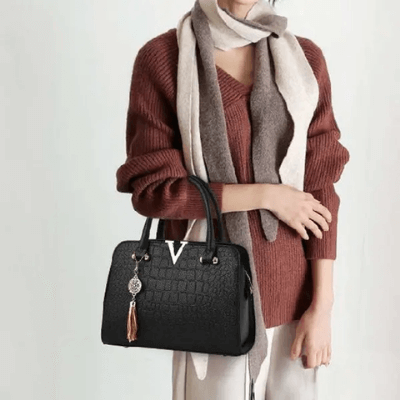 Elegante borsa a mano donna, texture effetto coccodrillo, ideale per eventi.