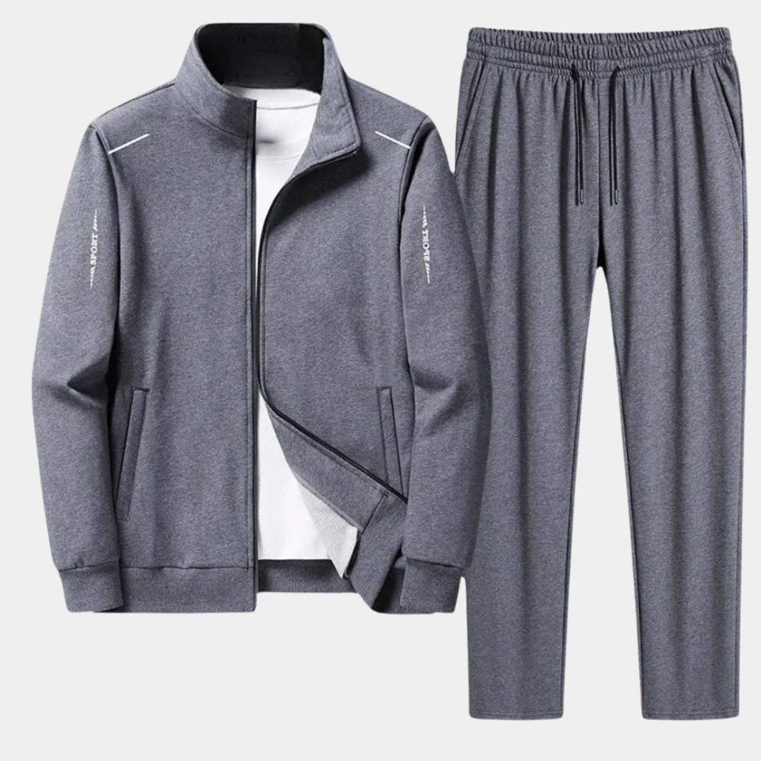 Tuta completa uomo con giacca sportiva e pantaloni jogger, ideale per allenamento, comfort e tempo libero.
