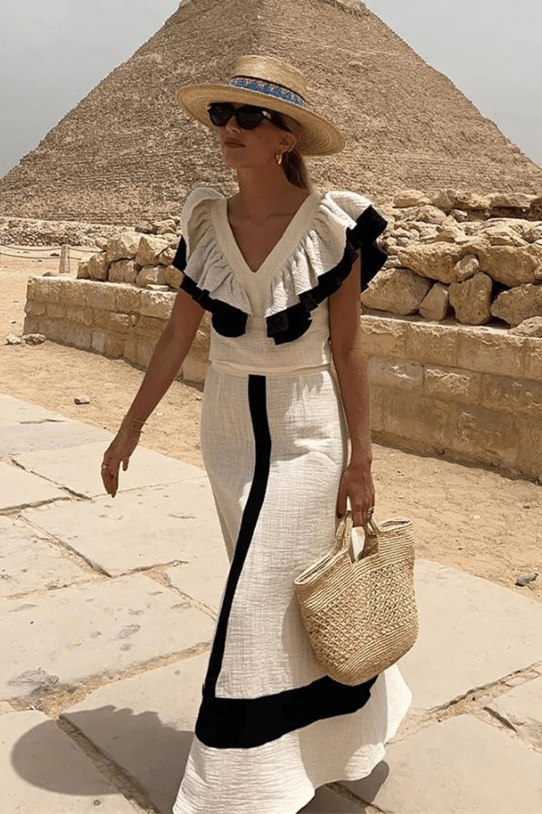 Set gonna midi estivo elegante da donna: top schiena scoperta e gonna vita alta, perfetto per look chic da vacanza.