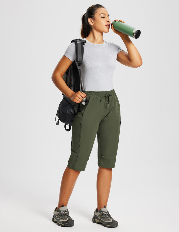 Pantaloncini capri donna per attività all'aperto, con tasche zip e vestibilità comoda.