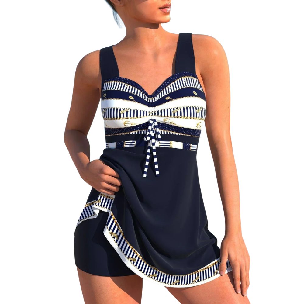 Costume intero donna marinaro blu notte con gonna chic. Perfetto per eleganza estiva e comfort in spiaggia o piscina.