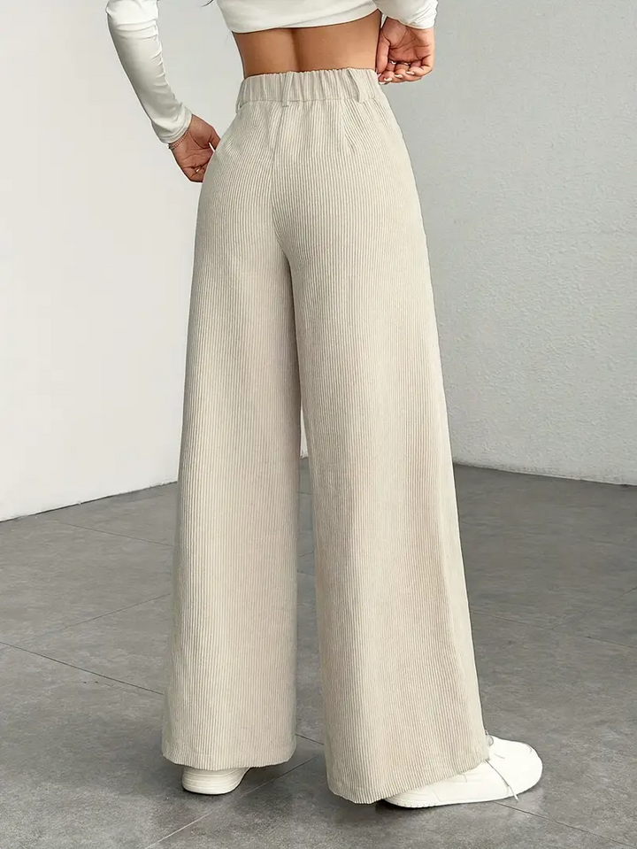 Pantaloni albicocca donna vita alta, gamba larga. Aggiungi un tocco di moda e comfort al tuo guardaroba casual elegante.